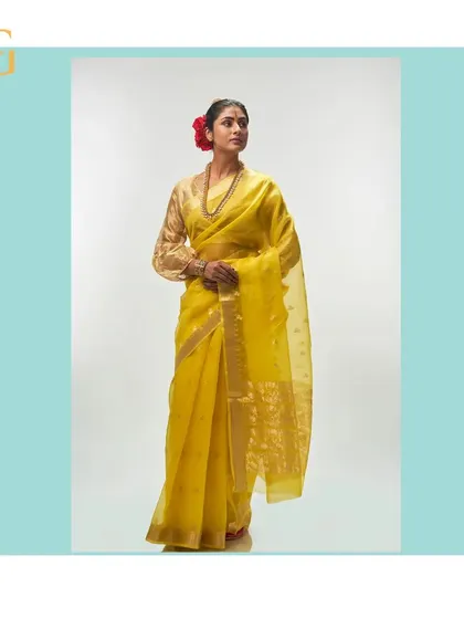 A full-length view of the cadmium yellow saree, a perfect choice for daytime festivities and celebrations.