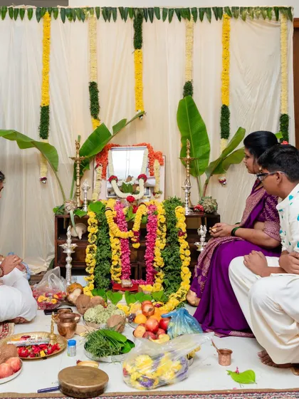 The full view of our family pooja. I designed the custom outfits for my son and myself to mark this important day. I can help you create coordinated traditional wear for any family ceremony or festival.