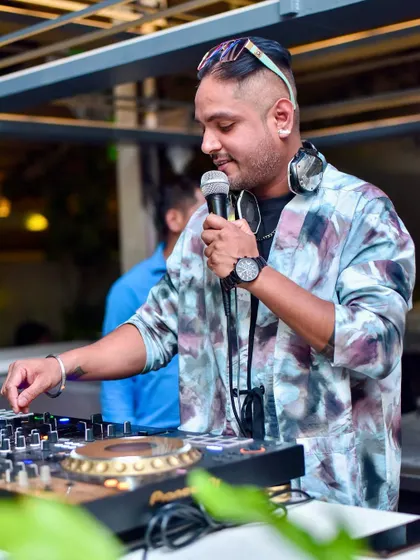 Here I am on the mic, interacting with the crowd at Hungry Hippie. A good DJ knows how to read the room and keep the energy flowing with the right tracks and a personal touch.