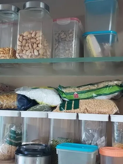 This is a common sight in many kitchens before we start. The first step is always to declutter and sort through everything to create a clean slate for an organized system.