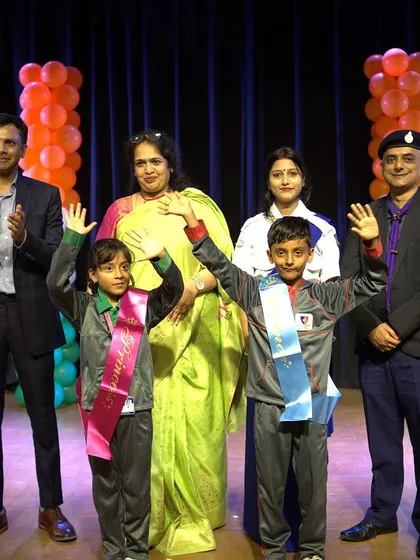 Winners of various competitions wave to the audience after being felicitated during the Republic Day awards ceremony.