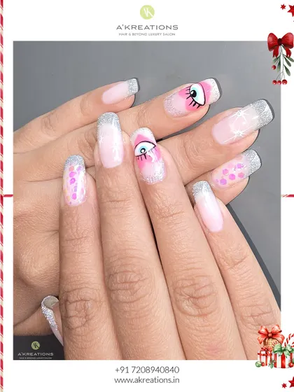 A final look at this creative holiday set, showing how the different elements like glitter, color, and hand-painted art come together on these long square nails.