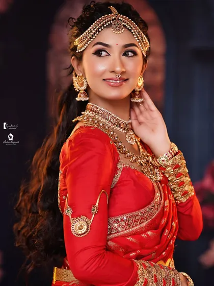 This angle shows the beautiful texture of the hair and the intricate details of the hair jewelry.