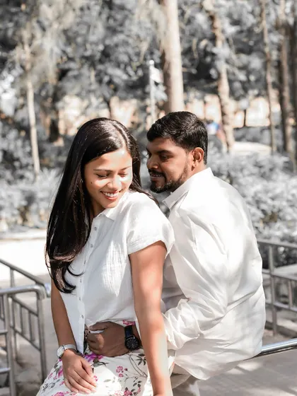 A duplicate of a previous candid shot, showing the couple sharing a happy and relaxed moment together.