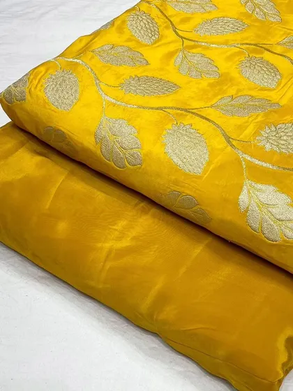 A bright and cheerful yellow jacquard fabric paired with its matching plain crepe. This combination is perfect for creating stylish and comfortable daywear or festive outfits.