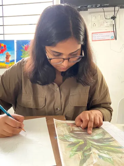 This student is carefully sketching her composition before starting to paint, an important first step we teach in our courses.