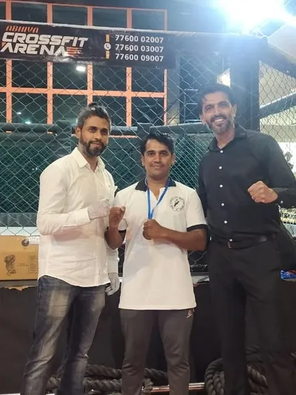 Our coaches celebrating their victories at an MMA club event. Their success, including a silver and two bronze medals, reinforces our teaching philosophy that coaches should lead by experience.