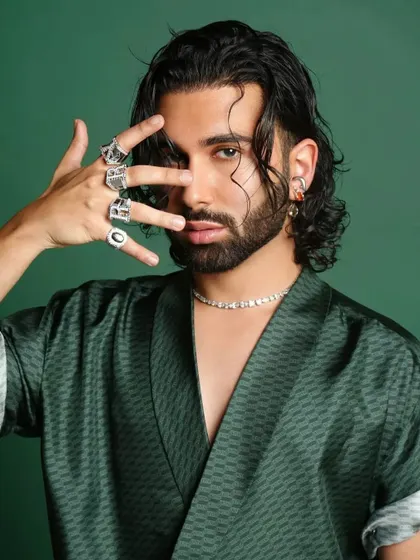 A close-up portrait of Orry from our GQ Best Dressed shoot. The focus here is on the attitude and the details: the wet-look hair, the diamond necklace, and the statement rings that complete his signature style.