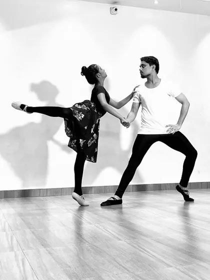 A black and white series featuring a male and female ballet dancer (ballerino and ballerina) practicing partner work. My classes include pas de deux techniques for advanced students.