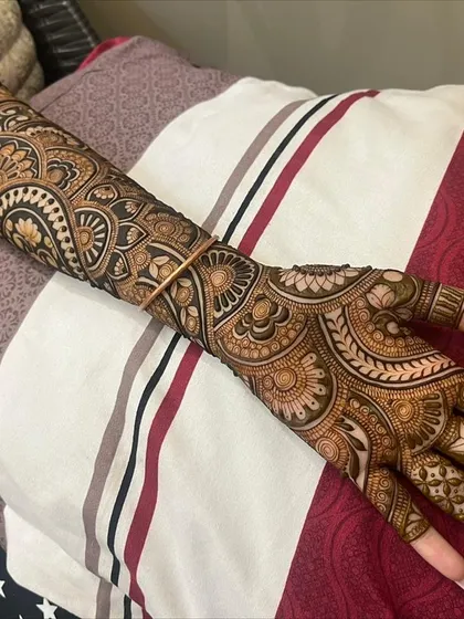 A full bridal arm design that incorporates a traditional elephant motif. This is a great example of how we can blend figurative art with classic patterns.