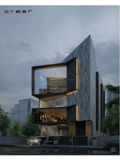 A conceptual render for a commercial building in Bangalore. The design features stacked, cantilevered glass boxes protruding from a monolithic stone-clad volume, creating dynamic workspaces with expansive views.