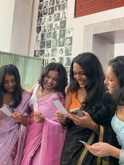 Friends in beautiful ethnic wear, sharing a happy moment over their new photos.
