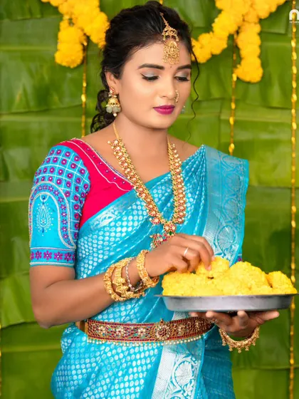 Another angle from the festive shoot, showing the vaddanam and bangles.