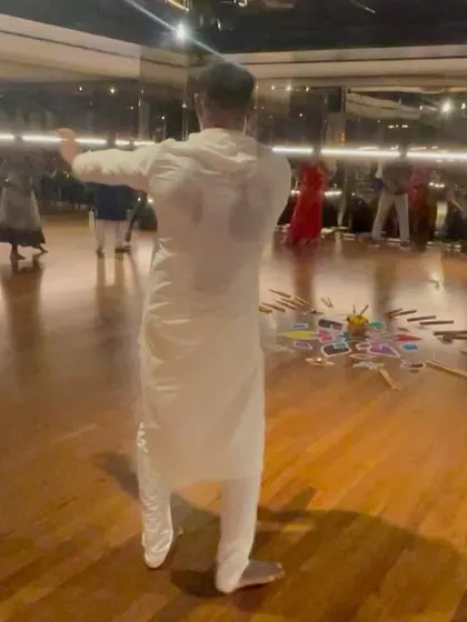 A view from behind as I lead the group in a traditional Dandiya dance.