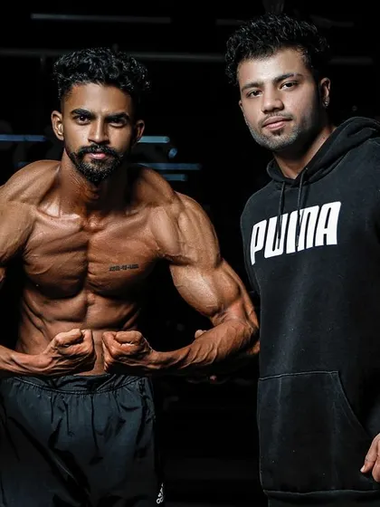Posing with a client after a successful photoshoot. My support extends beyond the gym floor to every aspect of their fitness journey.