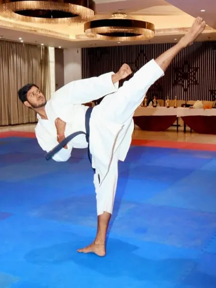 The beauty of karate lies in its technique. A demonstration of a perfectly executed high kick, a result of flexibility, balance, and countless hours of practice.