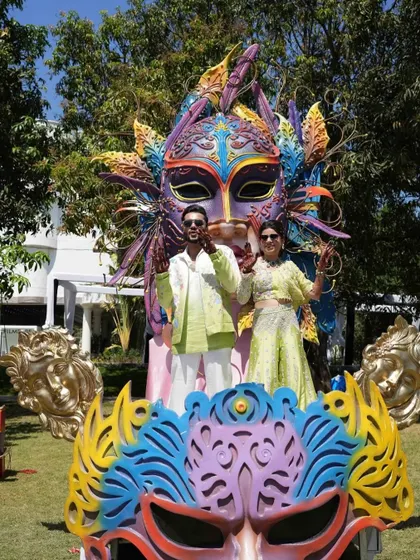 The couple posing for a photo on their grand carnival float, a perfect centerpiece for a fun-filled event.