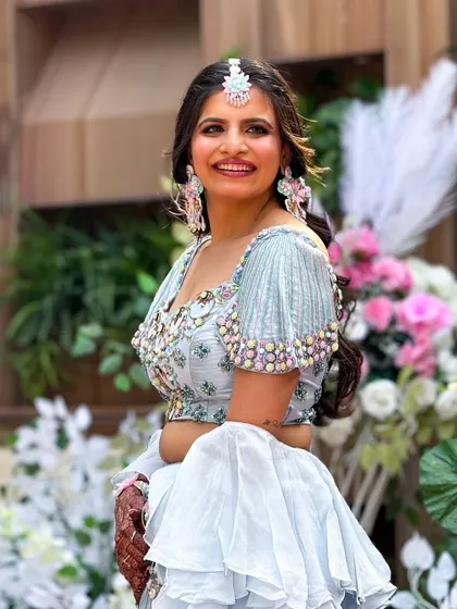 A full shot of the client at her outdoor event, looking radiant and happy.