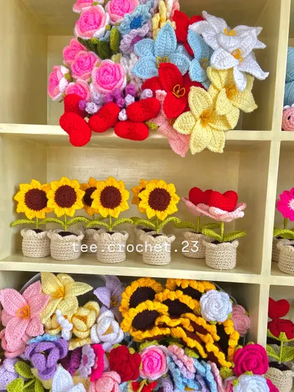 A mix of my creations on the shelf, including potted sunflowers and heart flowers.