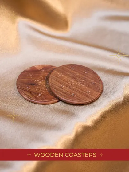 A close-up of the elegant wooden coasters included in our "Festive Bundle". It's the small, high-quality details that make a gift special.