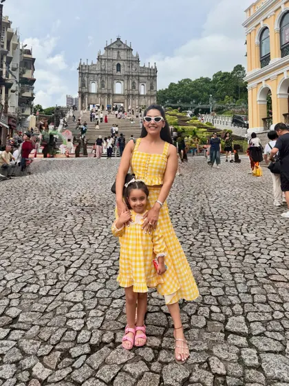 Creating coordinated mother-daughter outfits is one of my favorite things to do. This matching yellow gingham check co-ord set, featuring a skirt for me and a dress for Aarriya, is perfect for vacations and creating those picture-perfect memories.