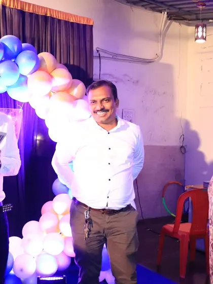 Sharing a laugh with a couple on stage during a community function.
