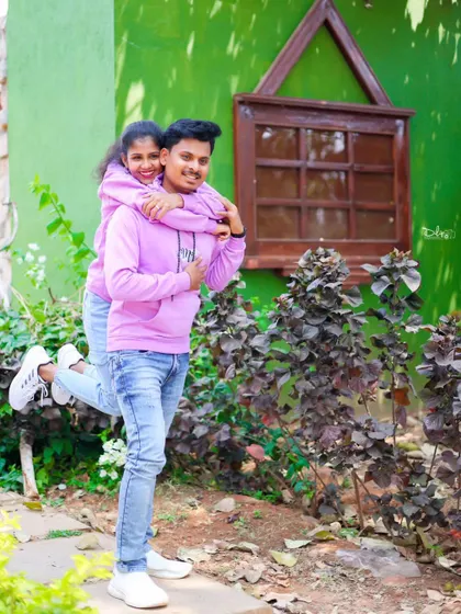 A playful piggyback ride during a pre-wedding shoot. These fun moments show the couple's true personality.
