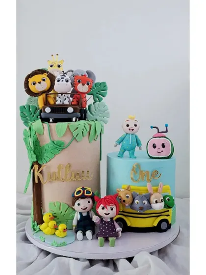 For this first birthday, we created a double-cake setup featuring a Cocomelon theme and a jungle safari. This allowed us to include all of the birthday boy's favorite things.