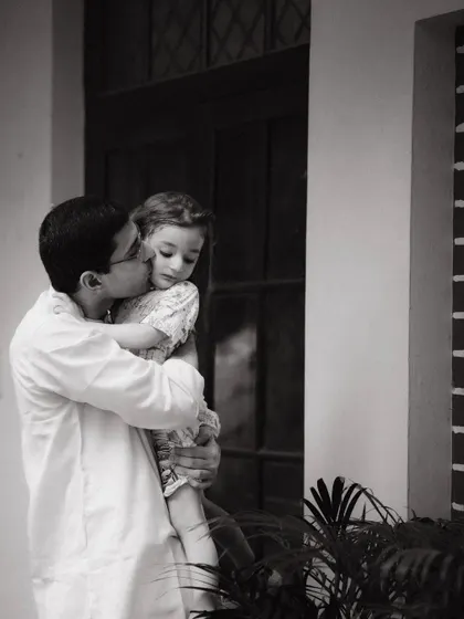 Sometimes the most powerful moments are the quiet ones. This black and white photograph of a father and daughter captures a tender, timeless bond that they will cherish forever.