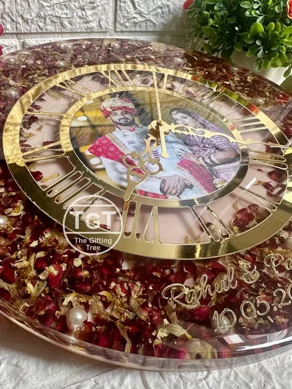 A side view highlighting the glossy finish and thickness of the resin clock. This process ensures the preserved flowers and photo are protected forever.