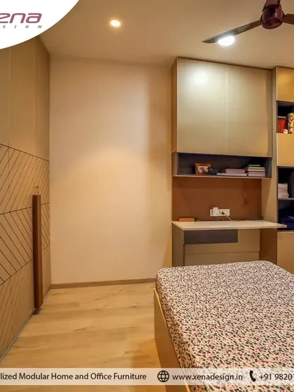 This bedroom was designed for two children, with separate beds and a shared, built-in study unit with ample shelving. The wall paneling behind the beds adds a nice textural detail.