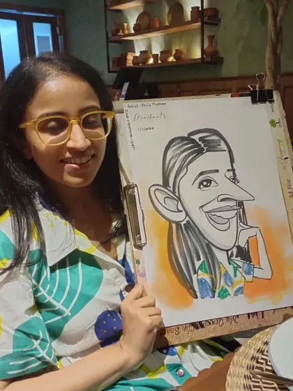 Her happy expression and cool glasses made for a great caricature subject.
