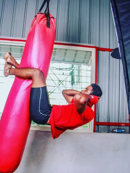 A strong core is your armor in a fight. We incorporate unconventional exercises like these heavy bag crunches to build the abdominal strength required to absorb body shots and power your own strikes.