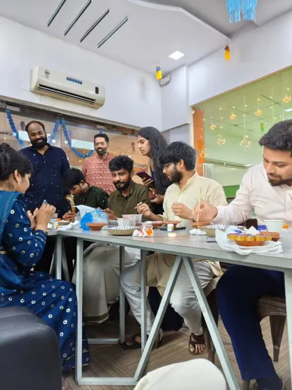 It’s all about shared moments. This candid shot shows team members enjoying the activity and each other's company during a special office event.