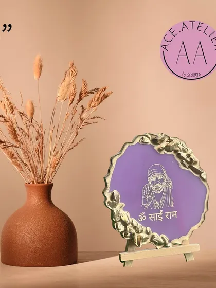 A 5-inch Sai Baba frame, ideal for small spaces. The purple background and gold accents give it a royal and serene feel.