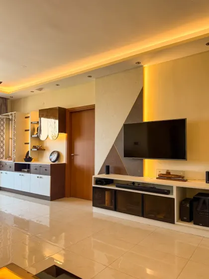 A wider view of the living and dining area, where different lighting zones are programmed to work together, creating a cohesive and inviting open-plan space.