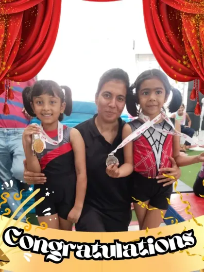 Our little champions celebrating their wins with a coach. These moments of joy and pride are what make the journey of gymnastics so rewarding for everyone involved.