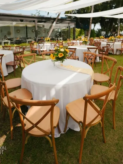 The guest seating area at the sunflower-themed Haldi, with tables and chairs perfectly arranged.