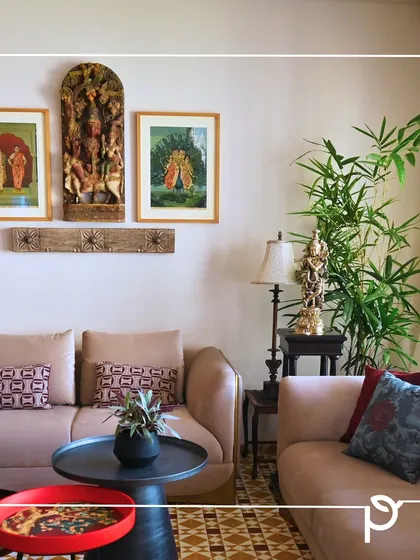 A tall bamboo plant adds a touch of grace and verticality to this traditionally decorated living room. We carefully select plants that complement the client's existing decor and thrive in the available light conditions.