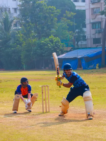 A batsman facing a bowler in our practice match, a classic duel between bat and ball.