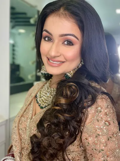 The smiling portrait shows how the makeup looks natural and radiant, not heavy. I teach techniques for creating comfortable, long-wearing makeup.