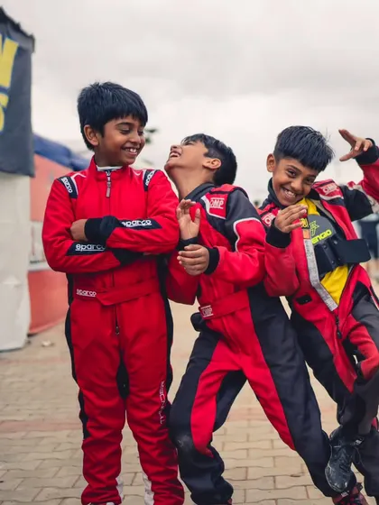The future of our team. Our youngest micro-max drivers sharing a laugh in the pits. We foster a fun and supportive atmosphere where friendships are built alongside racing skills.