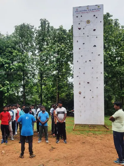 A briefing session in front of our portable climbing wall at the Ramanagara camp.