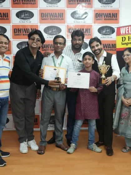 The entire team of teachers congratulates a student on her achievement.