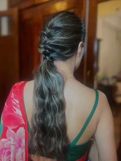 The final look, a chic and modern ponytail that is perfect for any occasion.