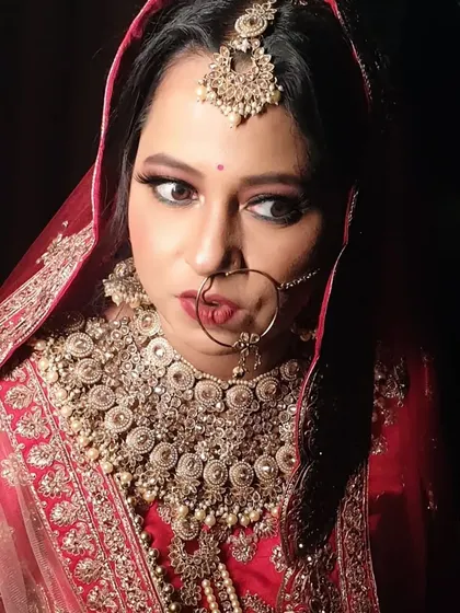 A candid moment capturing the bride's complete look. My goal is always to create a style that feels authentic to you, ensuring you look back at your photos and see the best version of yourself.