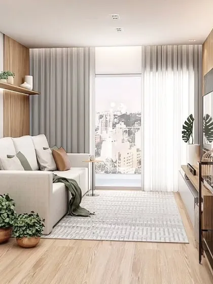 Another perspective of the compact living room, showing the use of a tripod floor lamp and floating shelves to add style without taking up floor space.