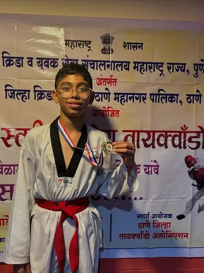 My student Asit Brahmane proudly showing his gold medal after the DSO competition. He is a dedicated athlete who always gives his best in training and in the ring.