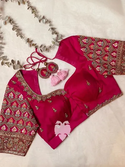 The full set of the pink zardosi blouse with matching tassels.