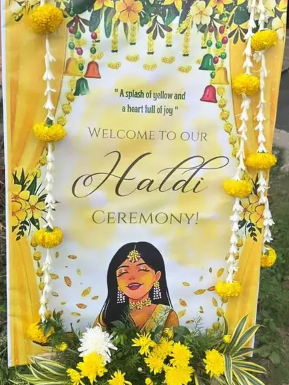 The welcome sign for a Haldi ceremony, decorated with marigold garlands. It’s these little details that make guests feel special from the moment they arrive.